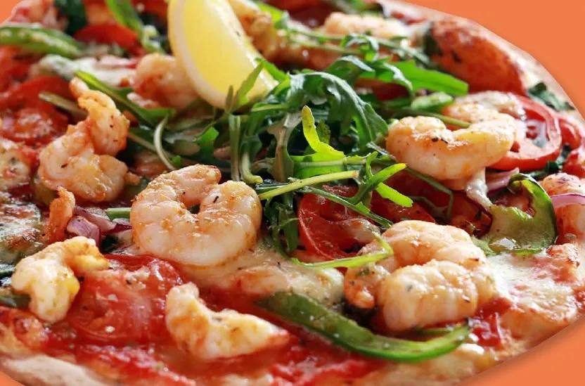 A prawn pizza on the Rocketboy Pizza website banner, photographed for a locally caught prawns campaign